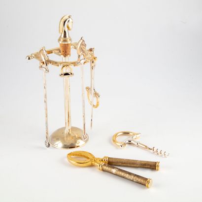 null Display and utensils in gilded metal including thermometer, corkscrew, pliers...