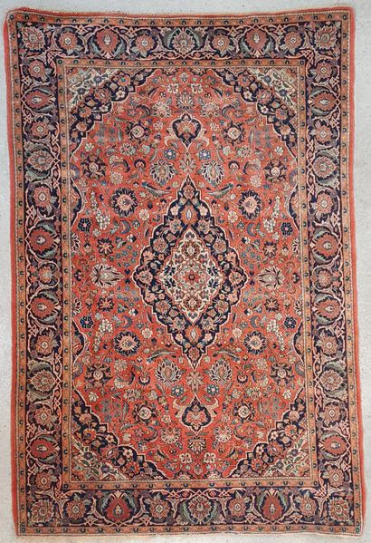 null Persian carpet with blue and cream floral scrolls on a coral background 

211...