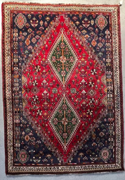 null Persian carpet Qashqai type with central decoration of two geometric medallions...