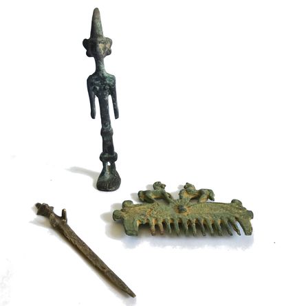 null Set of statuette and metal objects patinated in the ancient style of Lurist...