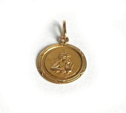 Médaille de baptême en or jaune (18K) ciselé...