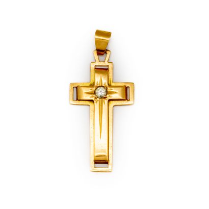 Petite croix en or ponctuée d'une pierre...