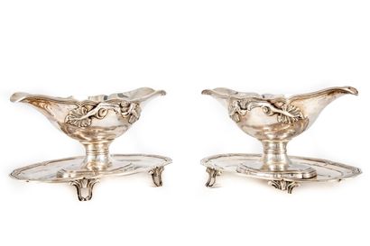 null Pair of silver sauce boats, double filets model with contoured edge, the handles...