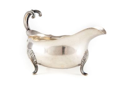 null Sauceboat on three silver feet with chased decoration on the feet and the catch...