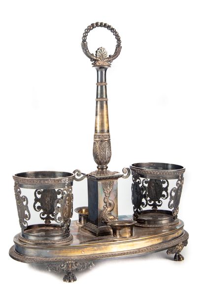 null Silver oil cruet decorated with friezes of pearls and palmettes, resting on...