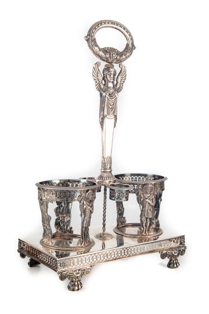 null Oil and vinegar holder in silver, the handle decorated with a sphinx, the mounts...