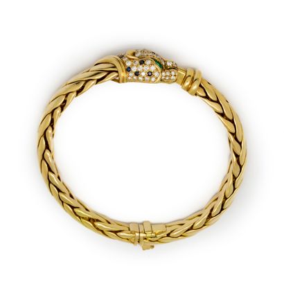 null Yellow gold gourmet bracelet with a panther in the center, open mouth paved...