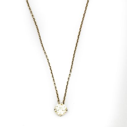 null White gold pendant mounted on a chain, adorned with a diamond weighing approximately...