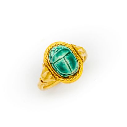 null Yellow gold ring surmounted by an enameled frit scarab in the ancient Egyptian...