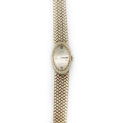 MOVADO MOVADO
Ladies' watch in white gold (750), oblong case with chased braided...