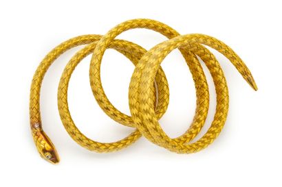 null Bracelet souple serpent en or jaune réalisé par l'enroulement de tubes de mailles...