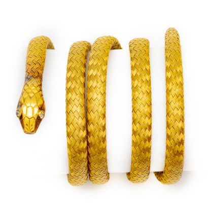null Soft bracelet snake in yellow gold made by winding tubes of tight meshes, the...