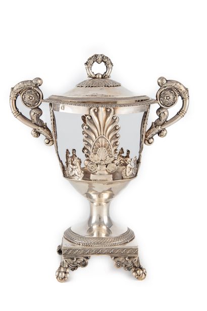 null Silver bowl with openwork decoration of palms, putti and goats, with two handles...