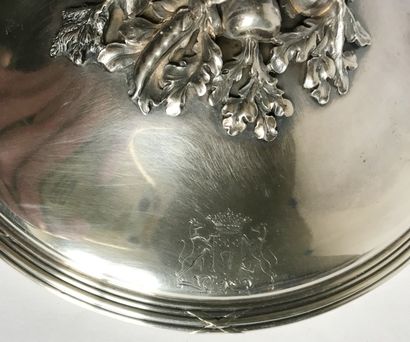 null A plain silver covered broth bowl with flat openwork ears finely chiseled with...