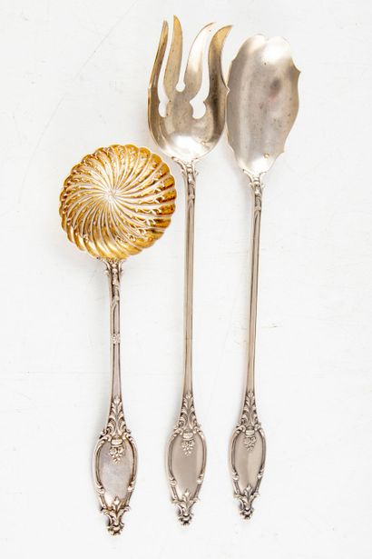 null Silver salad servers decorated with rocaille motifs. A sugar spoon of the same...