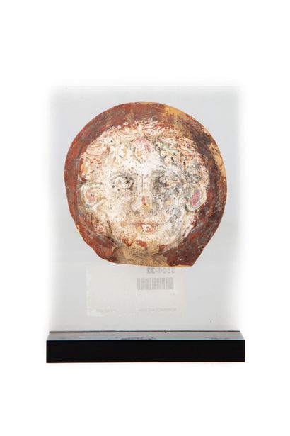 null Etruscan ex-voto, terracotta bas-relief forming a face, mounted on a pedestal...
