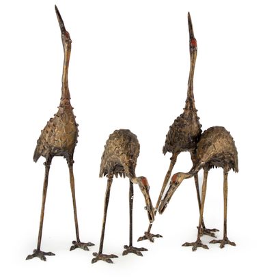 Set of four statuettes of stilt walkers in...