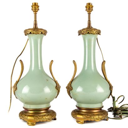 null Pair of celadon green porcelain bottle-shaped lamps with gilt bronze mountings....
