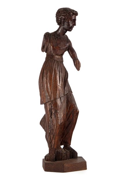 null Carved wooden statuette representing a male figure draped in the antique style...