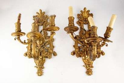 null Pair of ormolu sconces with three arms of light, finely chiseled decoration...