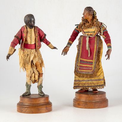 null Set of two crib figures in polychrome terracotta, wood and fabric representing...