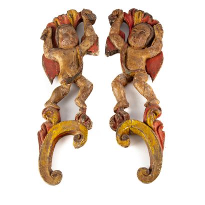 null Pair of sculptures in pickled wood formerly polychrome representing cherubs...