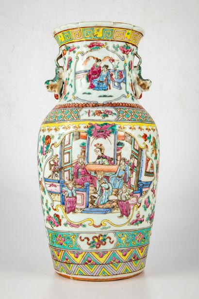 null CHINA 

Enameled porcelain vase decorated in the Famille Rose style with scenes...