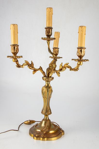 null Gilt bronze candelabra with four arms of light, decorated with foliage. Rocaille...