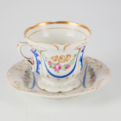 null Large enameled porcelain tea cup and saucer, decorated with gilded fillets and...