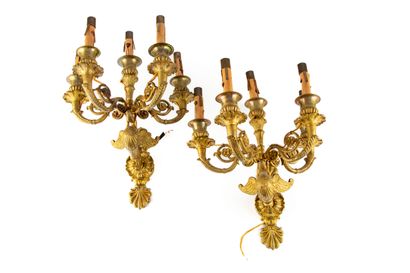 null Pair of ormolu sconces with four arms of light chased with palmettes and leaves....