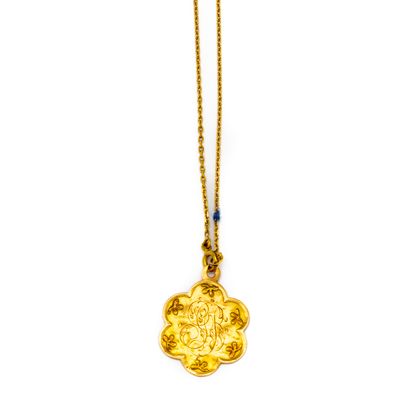 null Yellow gold chain (750th) holding a christening medal in yellow gold of poly-lobed...