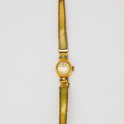 Lady's watch with yellow gold dial and gold...