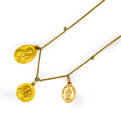 Necklace and three medals in yellow gold...