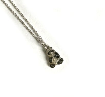 White gold necklace holding a panda-shaped...