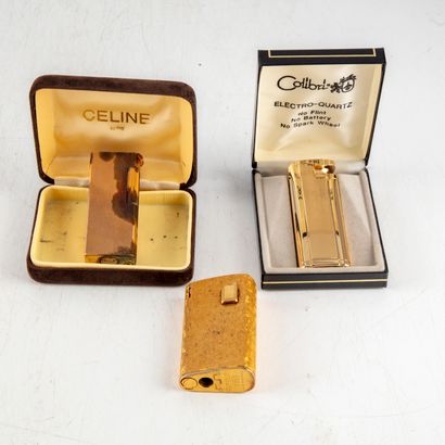 null Set of three gilt metal lighters of various marks. 
Stains on one