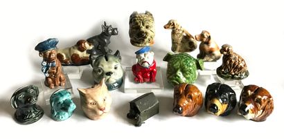 null Collection of 14 glazed ceramic moneyboxes in the shape of dog heads - sitting...