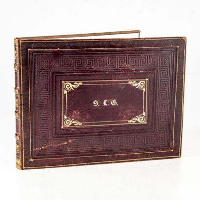 null Album of postcards and pictures
Bound in leather and decorated with the small...