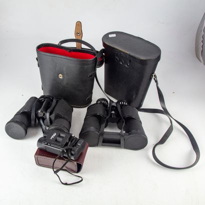 null Two pairs of binoculars and one smaller pair
In their cases