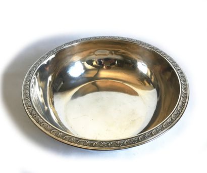 null Round silver bowl with molded and chased border of a leaf frieze. Style of the...