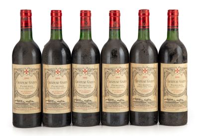 null "12 bouteilles Château Gazin 1986 Pomerol
(N. tlb à lb, E. f, m)"