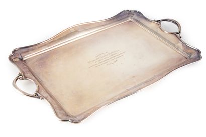 null Large serving tray of rectangular shape with a moulded edge. Lateral grips....