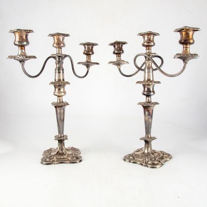 null Pair of silver plated candlesticks with transformation, which can be with one...