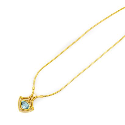 Gold necklace with a blue tourmaline pendant...