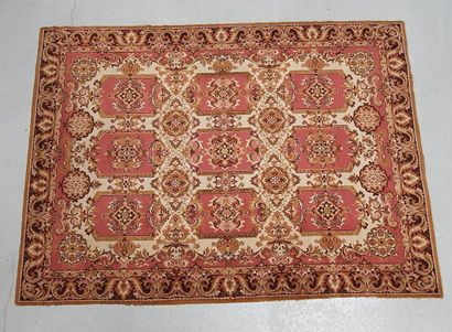 null Mechanical carpet with central medallions on beige fields. Border with frieze...