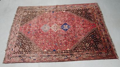 null Woolen Gachgai type carpet with floral decoration on pink field, spandrels....
