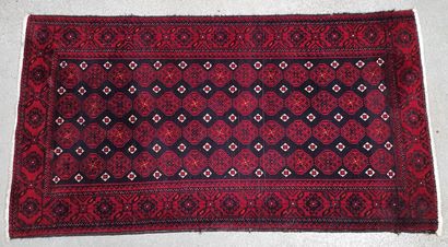 null Small wool carpet decorated with medallions in boxes on blue and burgundy field....