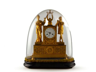 null Gilt bronze and chased clock featuring two musicians with zither, lyre and flute,...