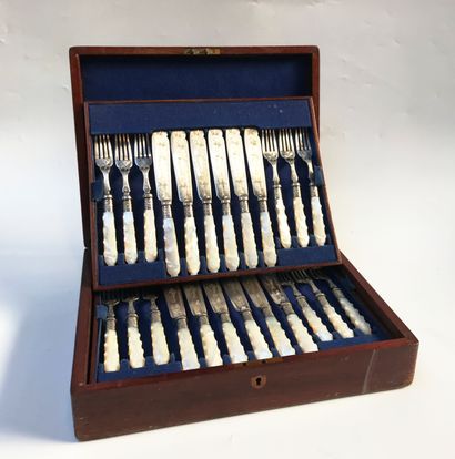 null Set of 12 engraved metal fish servers with mother-of-pearl handles. Presented...