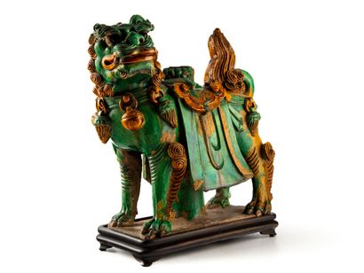 null CHINA, MING period, 17th century 
Chimera light-holder in green and yellow glazed...