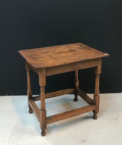 null Small oak table with rectangular top. It stands on four turned legs joined by...